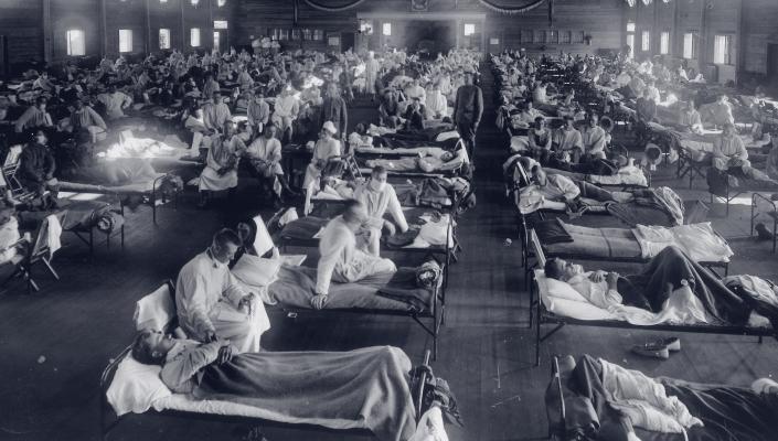 An emergency hospital at Camp Funston, Kansas, is packed with patients felled by the 1918 influenza epidemic.