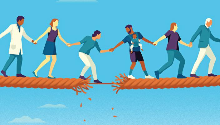 A group of people walk along a piece of fraying rope, holding hands.