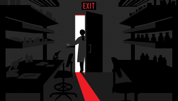 A silhouette of a scientist leaving their laboratory, the light from the doorway creates a red glow.