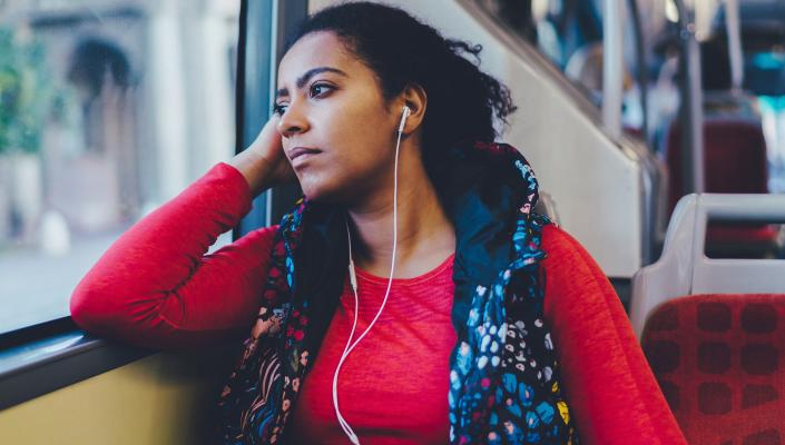 African American Woman riding a train