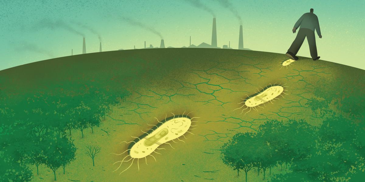 A person walks across a landscape out of a forest. Their footprints are bacteria. There are smokestacks from industry in the distance.