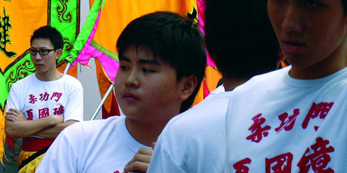 photo of 3 Chinese youths, one of whom appears to be overweight