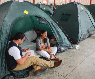 reporter interviewing migrant