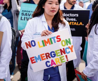 A group of doctors join abortion rights supporters at a rally outside the Supreme Court on April 24, 2024 in Washington, D.C. 