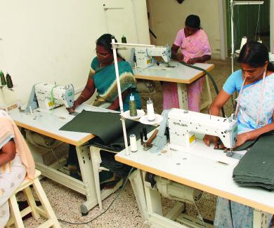 3 Indian women working at sewing machines