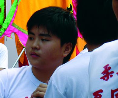 photo of 3 Chinese youths, one of whom appears to be overweight