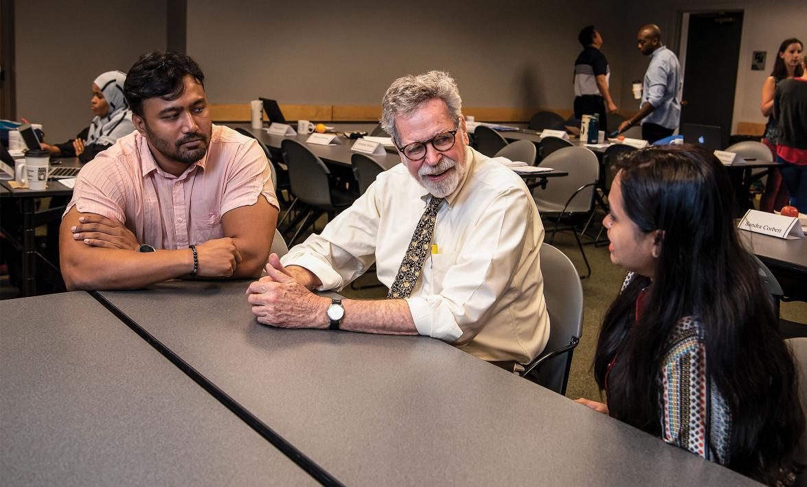 Gil Burnham speaks with students