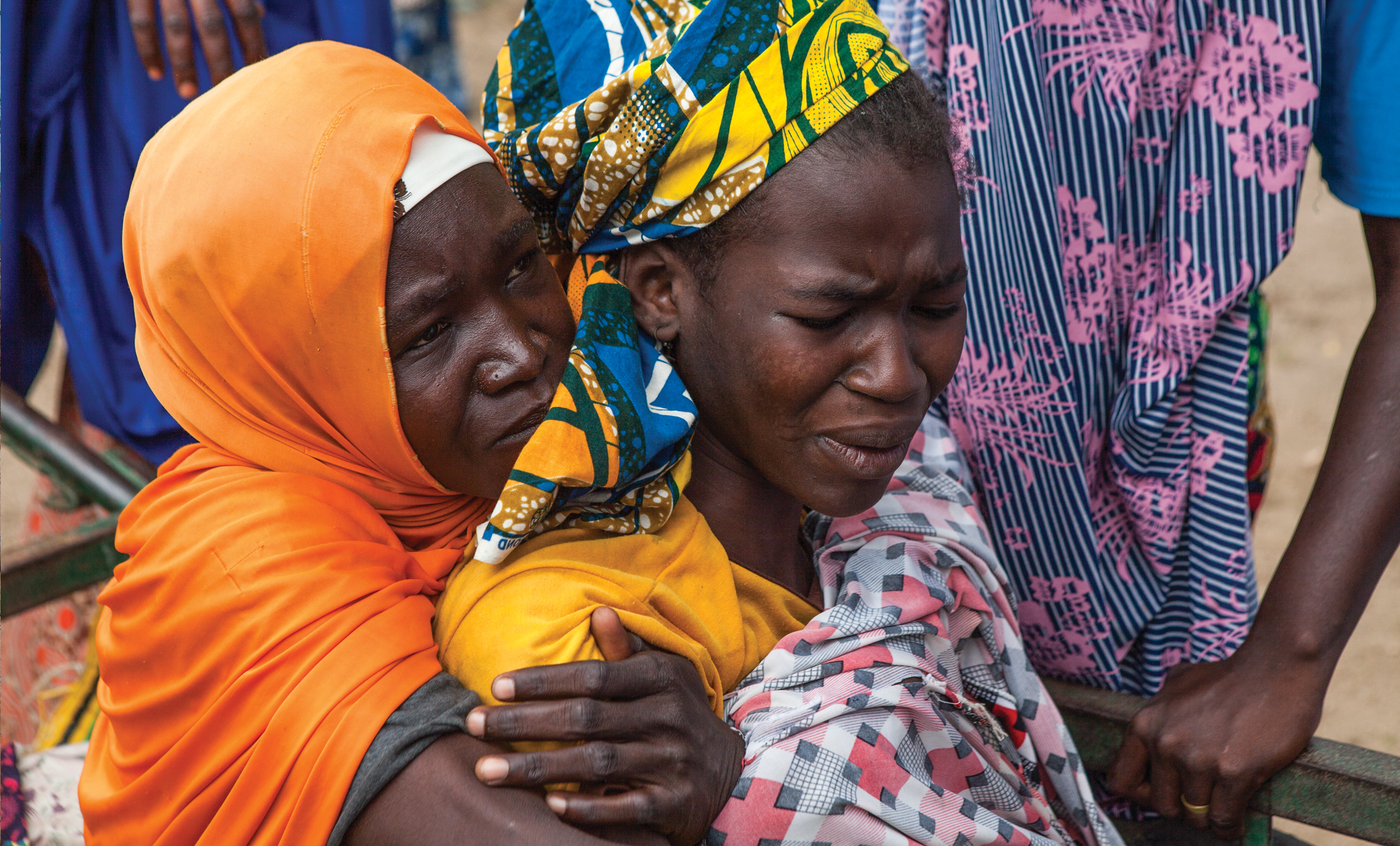 A woman suffering from severe malaria writhes in pain outside of the Unicef clinic where she was referred to MSF in Gwoza, Nigeria, on September 29, 2016.